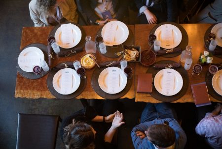 Business-conference-lunch-meeting-people-around-a-table-with-plates